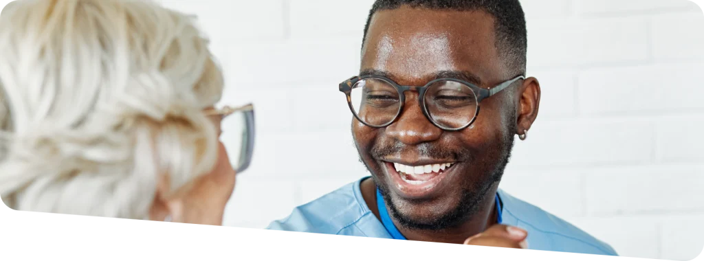 An adult care worker with a resident.