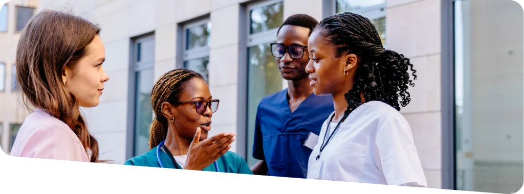 A group of adult social care professionals having a discussion at work.